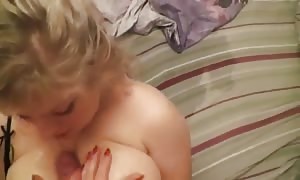 plump hot
 blond
 supplies a titjob and gets sperm on her face