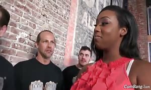 Big-breasted ebony
 prostitute staying on her knees and deep-throating white schlongs