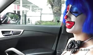 Clown teen sucking huge boner in the automobile
