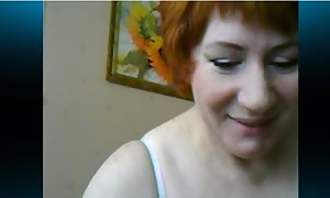 Playful red haired whore is revealing her steamy shapes on the video