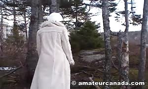 fancy fetish woman is posing disrobing right in the woods