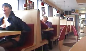 huge-boobed babe flashing in a restaurant