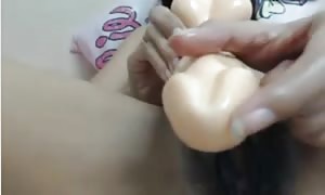 Thai girl, furry pussy nails herself with pretend
 manhood