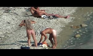 fuck-friends pounding on a public beach, while walking past folks